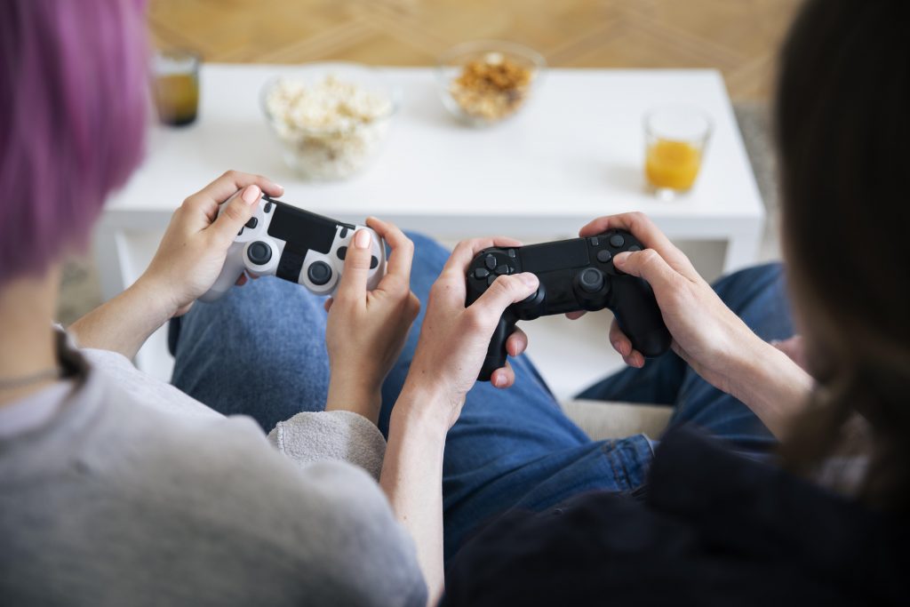 young couple playing video game indoors